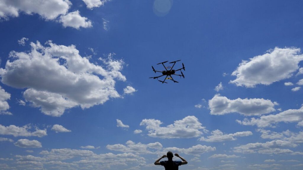 FILE - Oleg flies a drone while testing it on the outskirts of Kyiv, Ukraine, Wednesday, June 8, 2022.