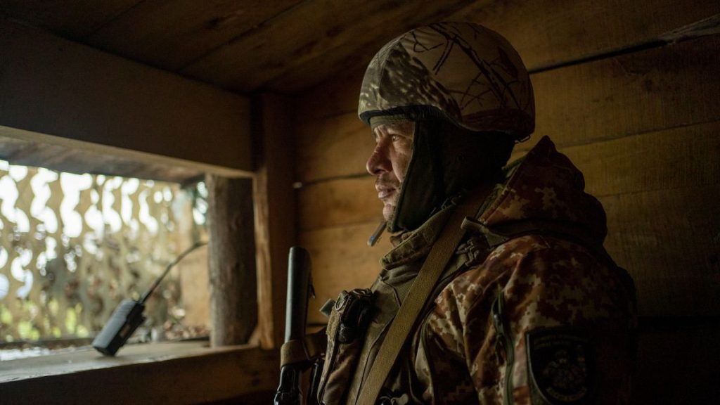 Ivan Kravchenko, a soldier of the state border guard, stands watch at a post where Ukrainian troops monitor Russian positions in the Sumy region, Ukraine, on Nov. 24.