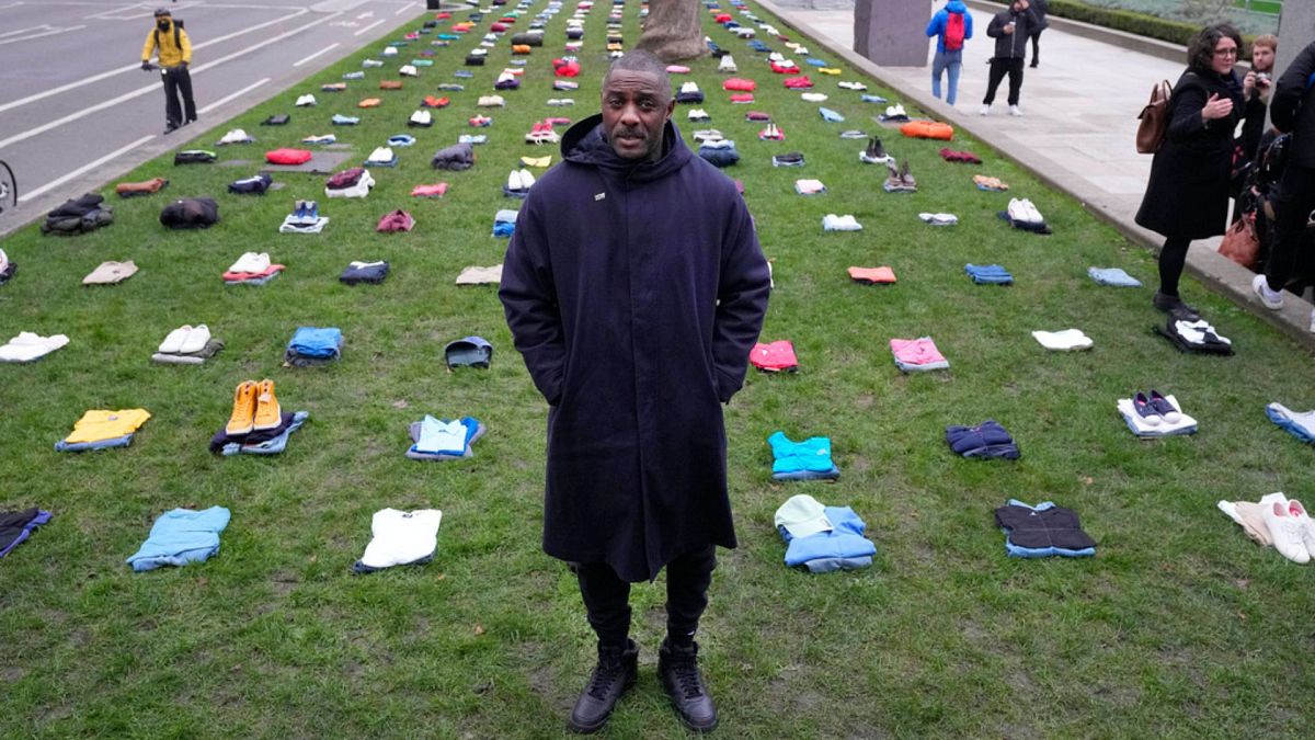 Idris Elba stands in Parliament Square with clothing representing the human cost of UK Knife Crime in London, Monday, Jan. 8, 2024.