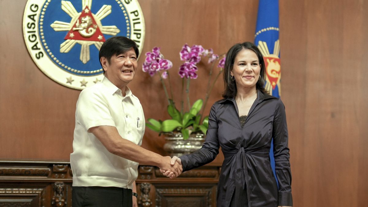 Philippine President Ferdinand Marcos Jr., left, greets German Foreign Minister Annalena Baerbock during her courtesy call at the Malacanang presidential palace in Manila