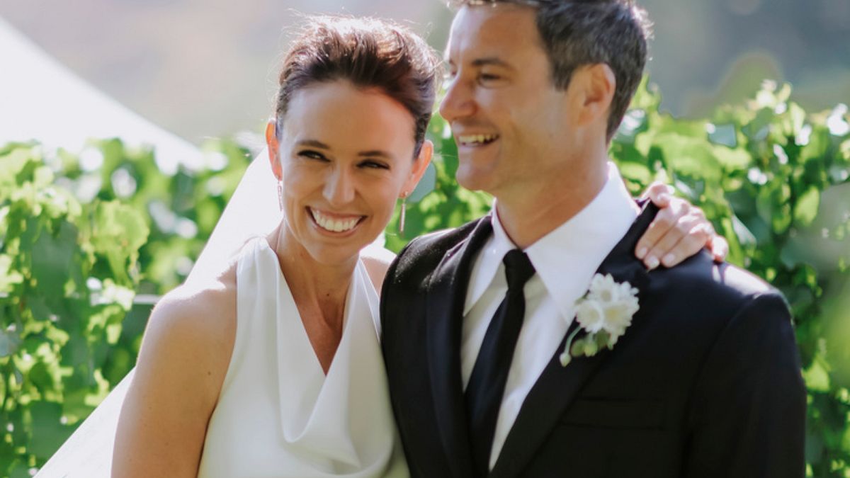 Former New Zealand Prime Minister Jacinda Ardern embraces her husband Clarke Gayford at their wedding in Havelock North, New Zealand on Saturday