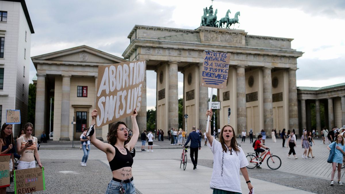 Protestors at a demonstration against the US Supreme Court decision to overturn Roe v. Wade in front of the Brandenburg Gate near the US embassy in Berlin in July 2022.