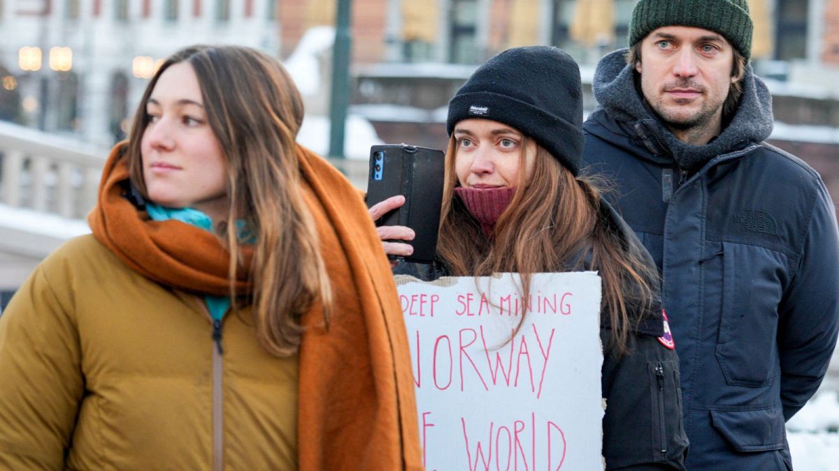 Activists from the French environmental movement attend a protest outside the Norwegian Parliament in Oslo, Tuesday, Jan. 9, 2024.