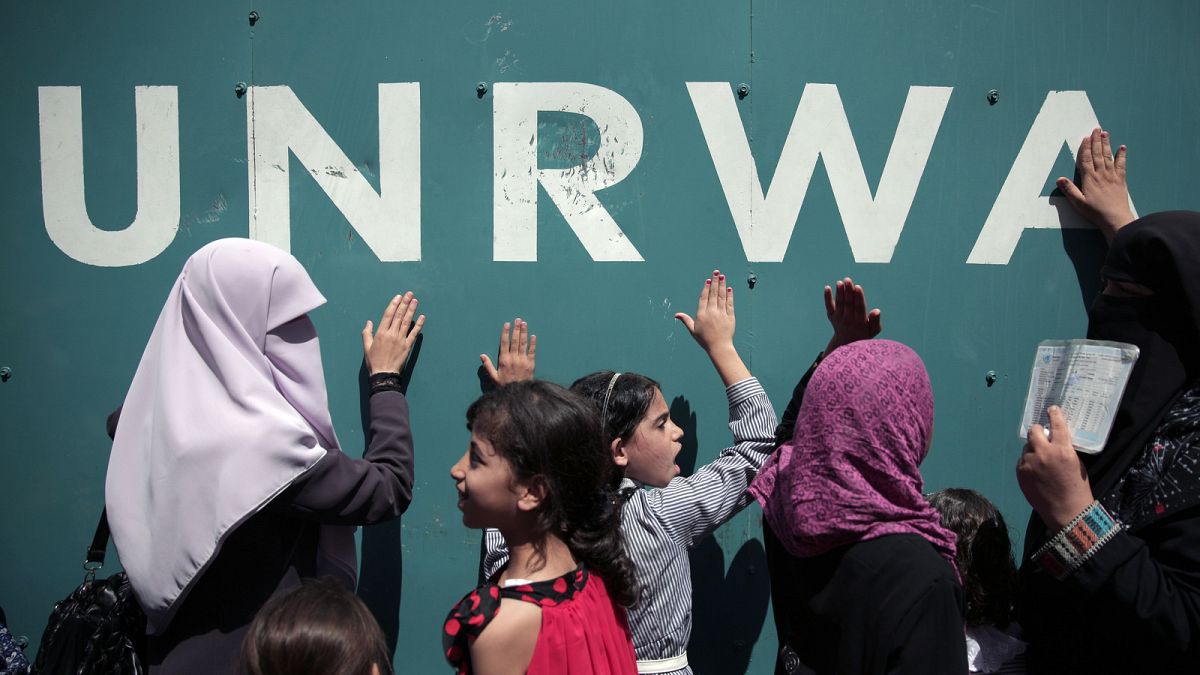 Palestinians demonstrate outside the UN Relief and Works Agency (UNRWA) headquarters in Gaza City