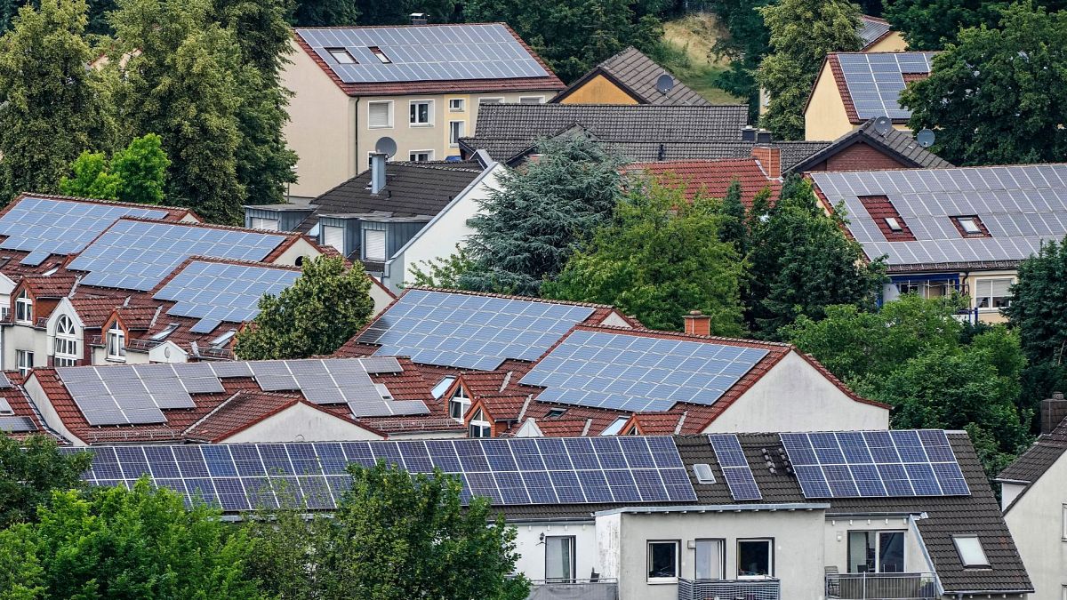 Solar panels are mounted on the roofs of apartment buildings in Bottrop, Germany, June 26, 2023.