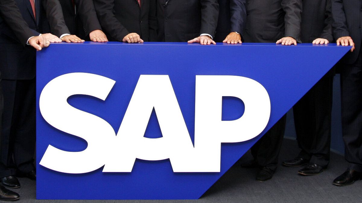 In this July 31, 2008 file picture the board members of German software company SAP are seen behind the company logo at it