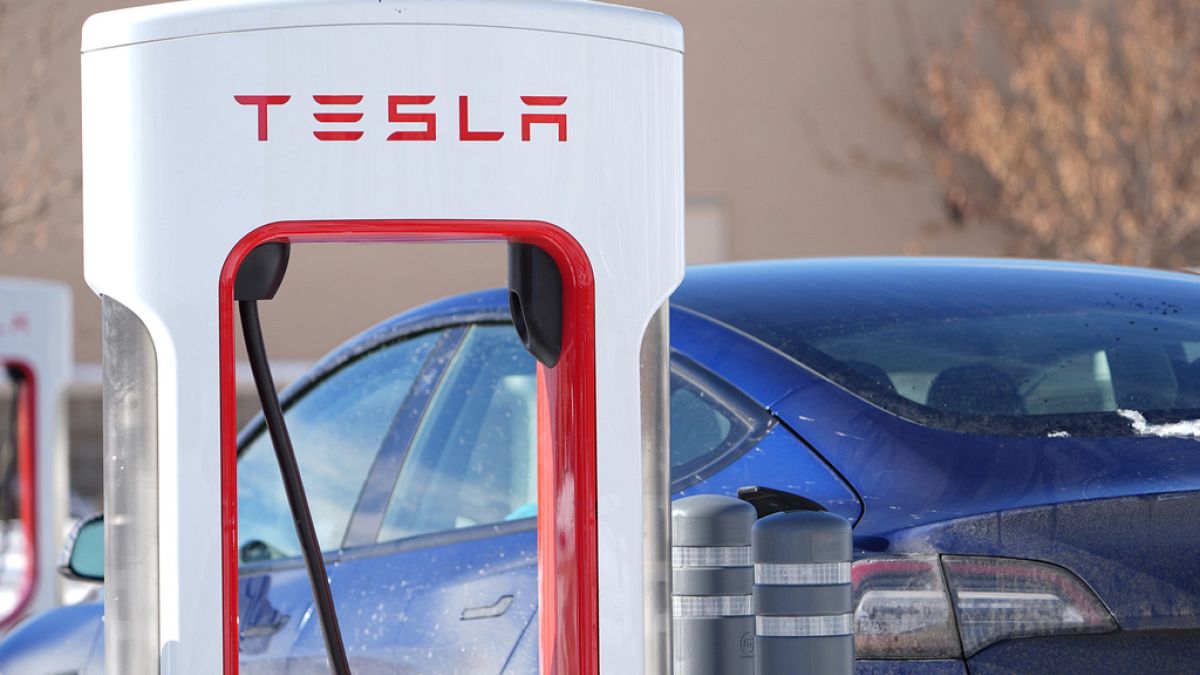 Motorists recharge their Tesla vehicles at a Tesla supercharging location Tuesday, Jan. 16, 2024, in northeast Denver.