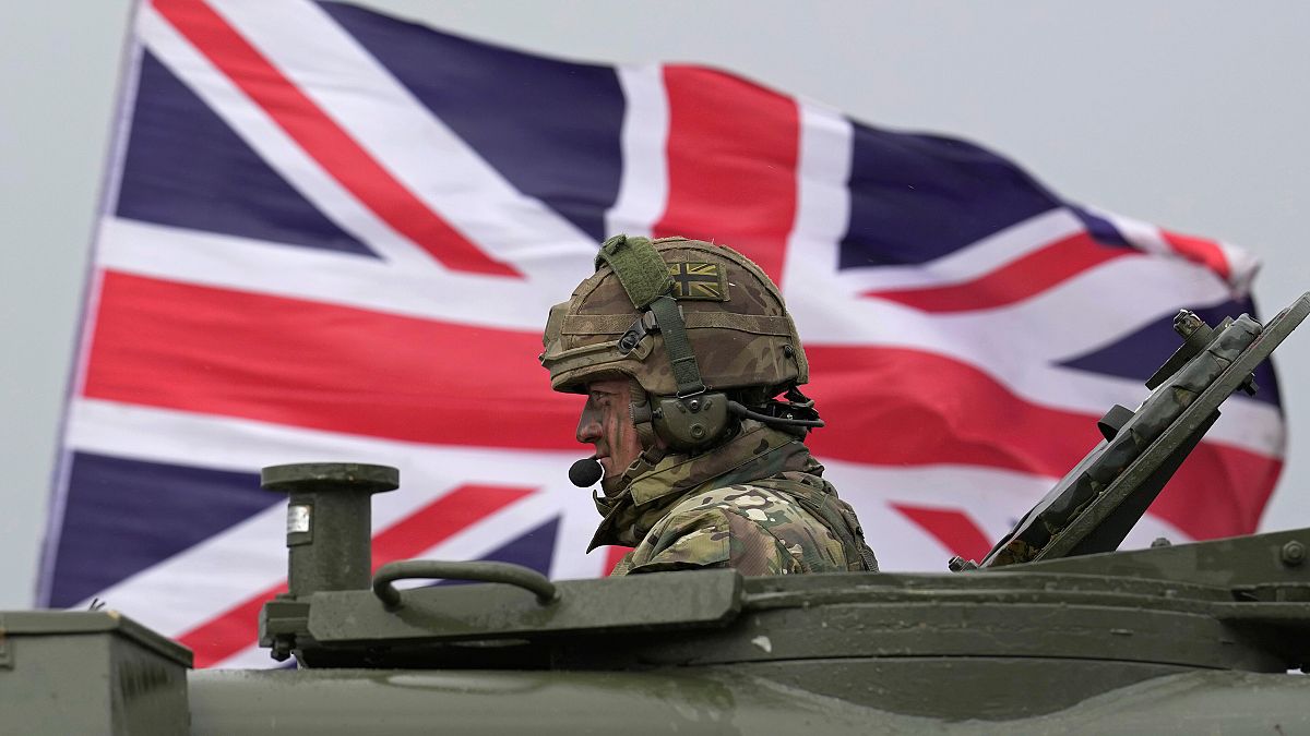 A British soldier sits in an AS90 as take part in a military exercise with Ukrainian soldiers at a military training camp in an undisclosed location in England.