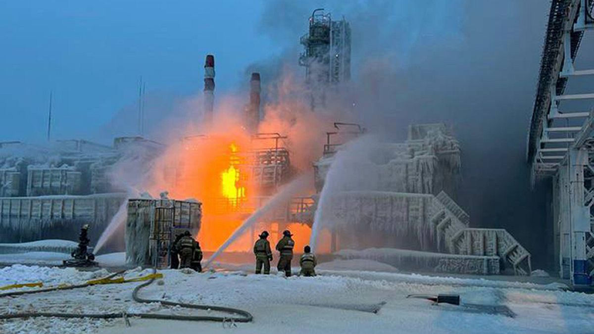 Fire fighters extinguish the blaze at Russia