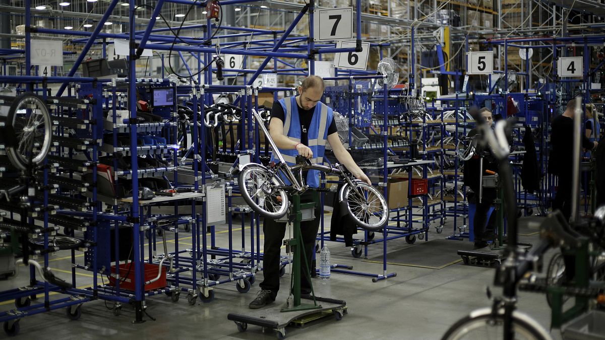 Brompton folding bicycles are assembled by hand at the Brompton factory in west London, Tuesday, Nov. 24, 2020.