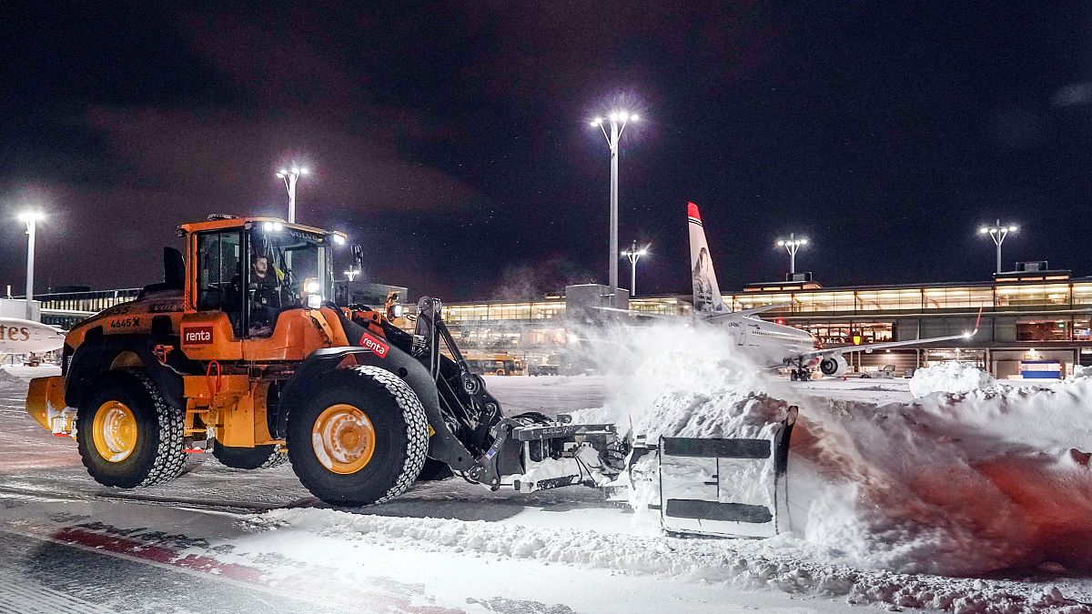 Plow crews in action at Oslo Airport Gardermoen in Gardermoen, Norway, Wednesday, Jan. 17, 2024.