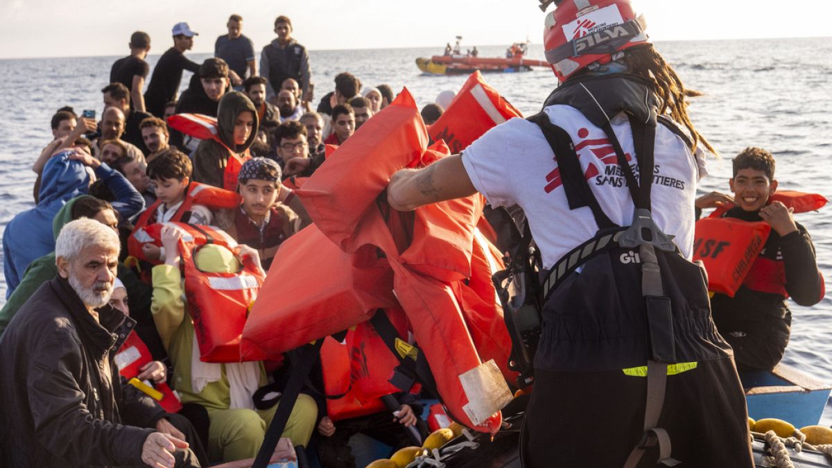 Migrants headed for the coast of Italy are rescued