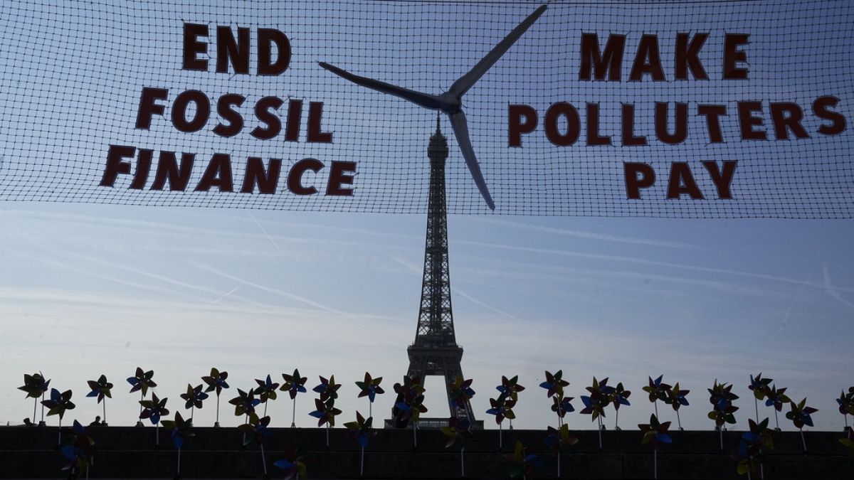 Climate activists stage a protest in Paris, June 2023