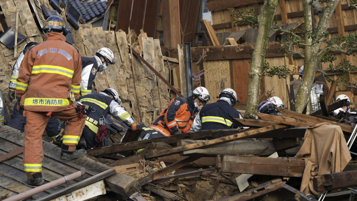 Rescuers conduct a search operation in Wajima, Ishikawa prefecture, Japan Friday, Jan. 5, 2024.