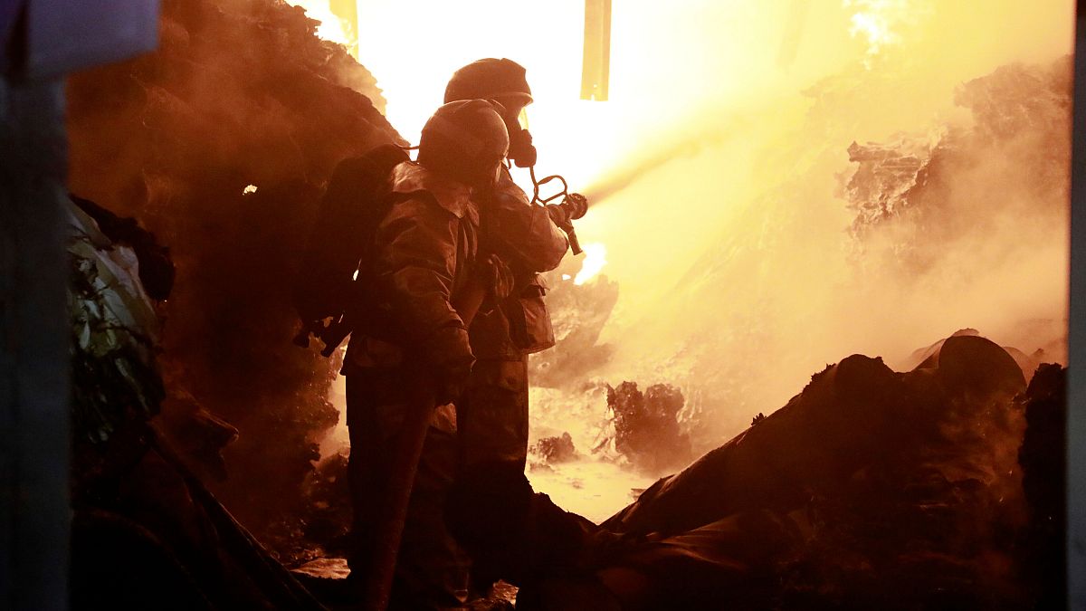 Firefighters put off a fire caused by an explosion at an industrial building in Nairobi, Kenya.