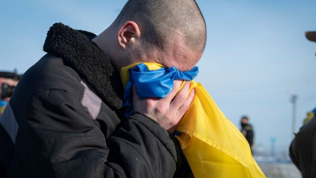 This photograph shared by Zelenskyy on X on Jan. 31, 2024, shows Ukrainian prisoners of war react after after a prisoner exchange at an undisclosed location, Ukraine.