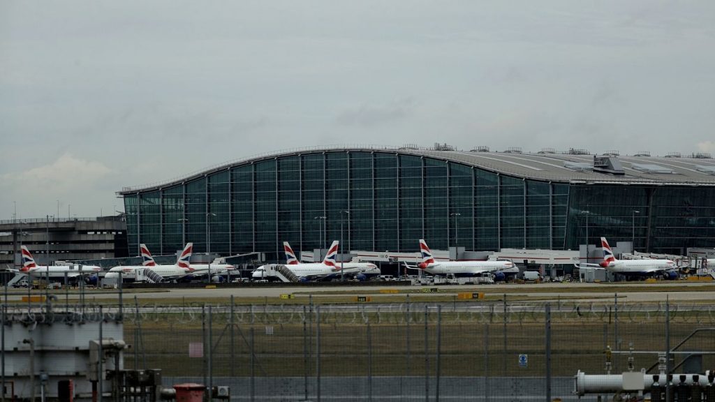 British Airways planes sit parked at Heathrow Airport in London.