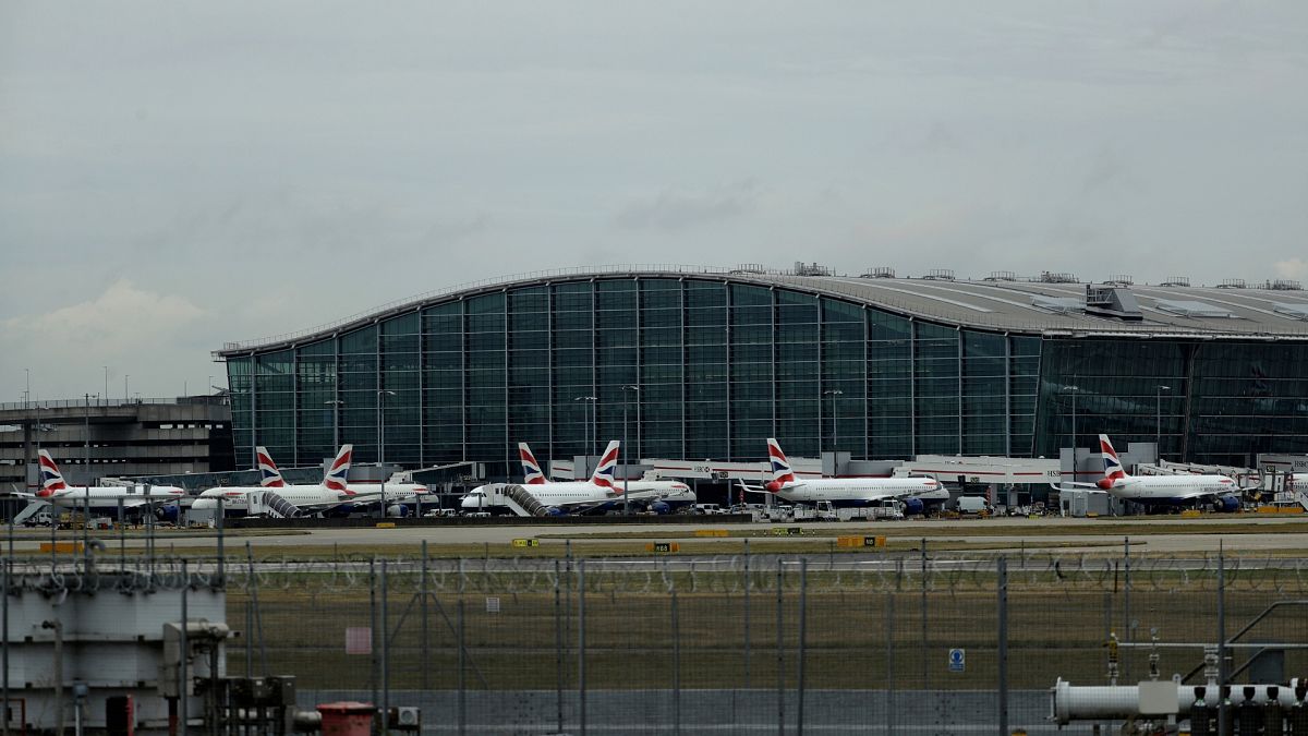 British Airways planes sit parked at Heathrow Airport in London.