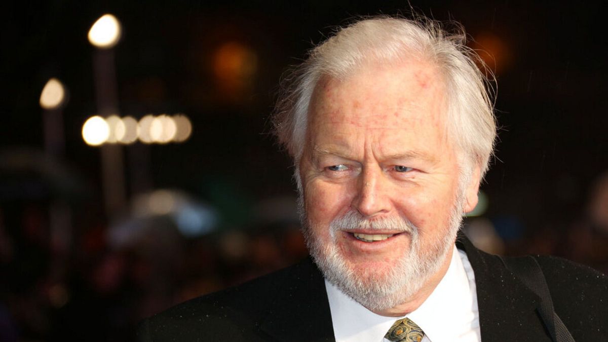 Ian Lavender poses for photographers upon arrival at the World premiere of Dad