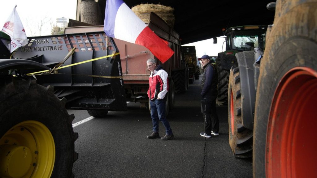 Farmers walk on a blocked highway, Wednesday, 31 January, 2024 in Chilly-Mazarin, south of Paris.