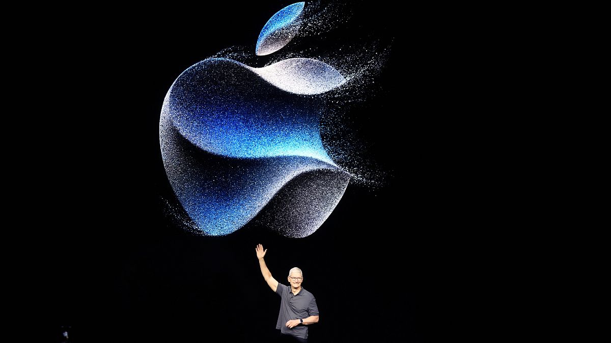 Apple CEO Tim Cook waves at an announcement of new products on Sept. 12, 2023, in Cupertino, Calif.