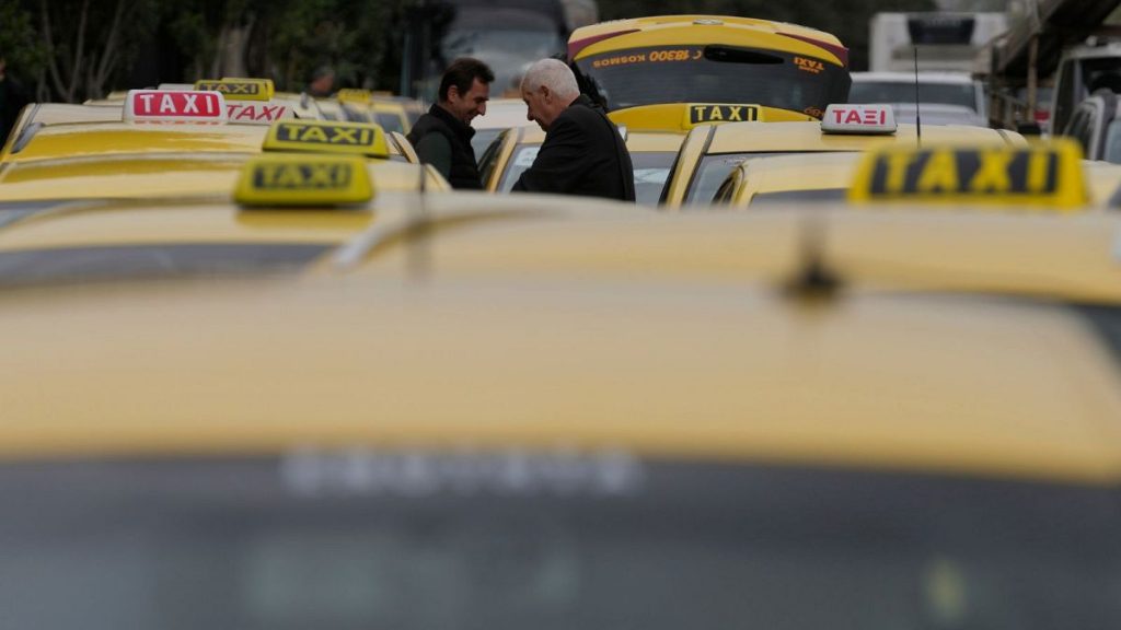 Taxi drivers gather during their rally in Athens, Greece, Tuesday, Feb. 27, 2024.