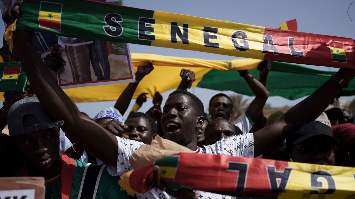 FILE - People shout slogans during a protest against the possibility of President Macky Sall to run for a third term in the 2024 presidential elections in Dakar, Senegal,