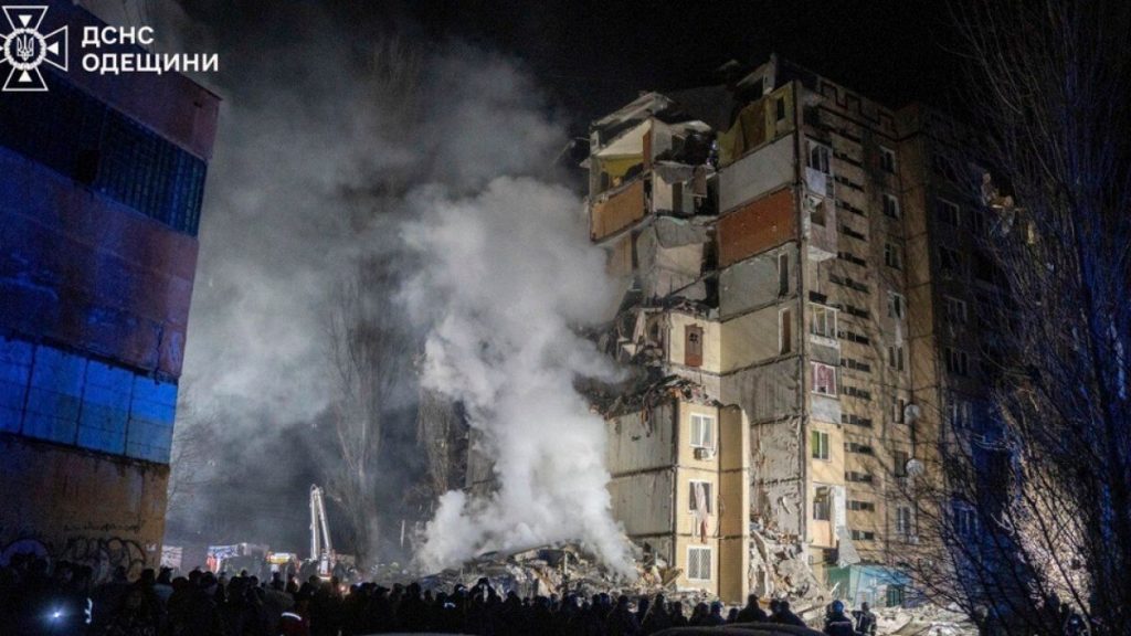 Emergency workers clear the rubble on the site of a destroyed multi-store building after a Russian attack on residential neighbourhood in Odesa, Ukraine, 2/3/24.