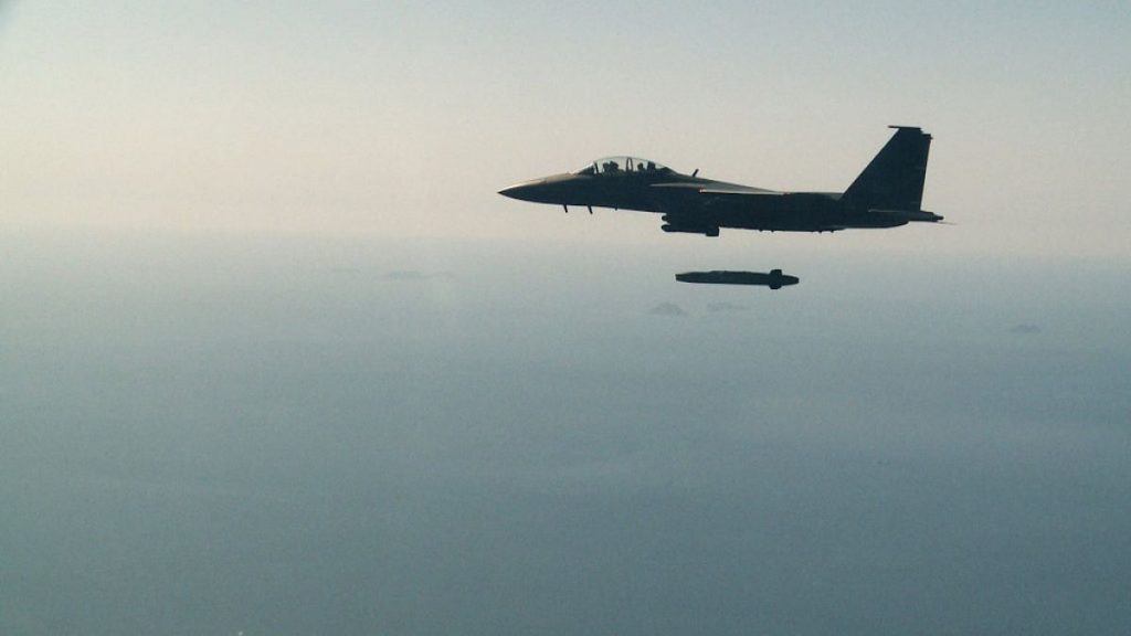 A South Korean air force F-15K fighter jet releases a Taurus missile during a drill off the country