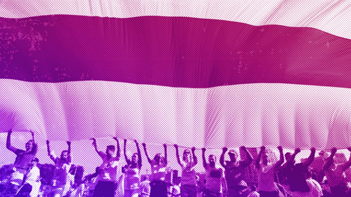 Opposition supporters wave a red-and-white flag as they rally in the centre of Minsk, August 2020