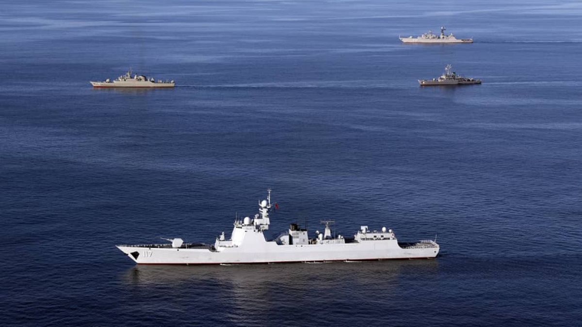 In this file photo provided by the Iranian Army, warships sail in the Sea of Oman during the second day of joint Iran, Russia and China naval war games on Dec. 28 2019