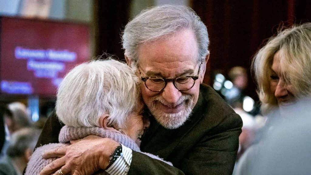 Steven Spielberg hugs Holocaust survivor Daisy Miller, of Studio City, as they attend a University of Southern California Medallion event