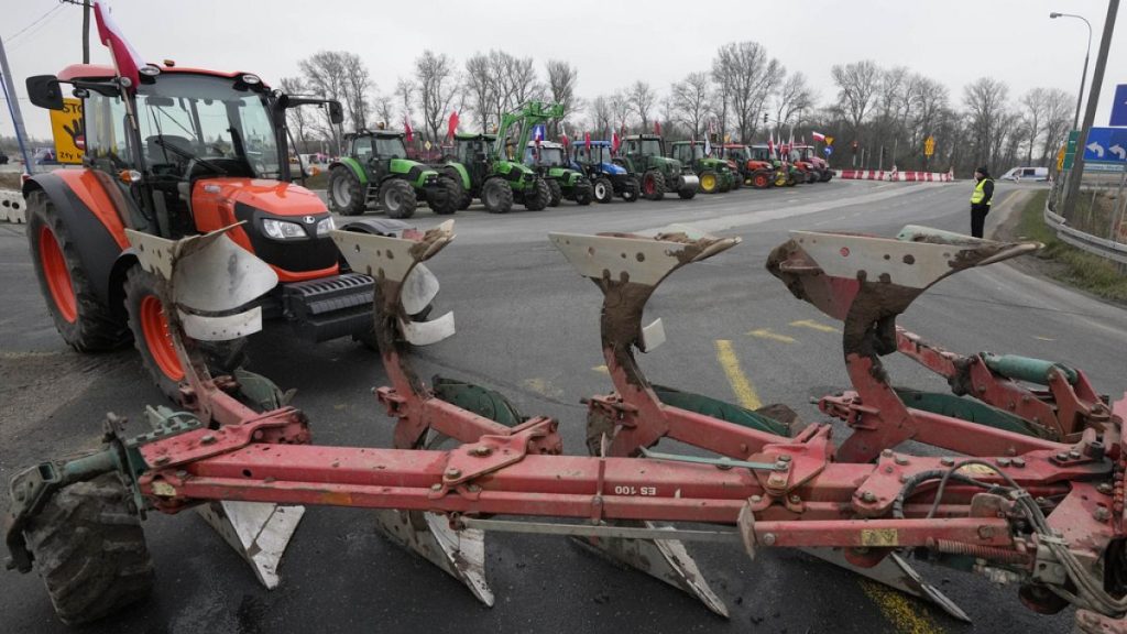 Polish farmers block roads with tractors in Kazun Polski near Warsaw, Poland, on Wednesday March 20, 2024