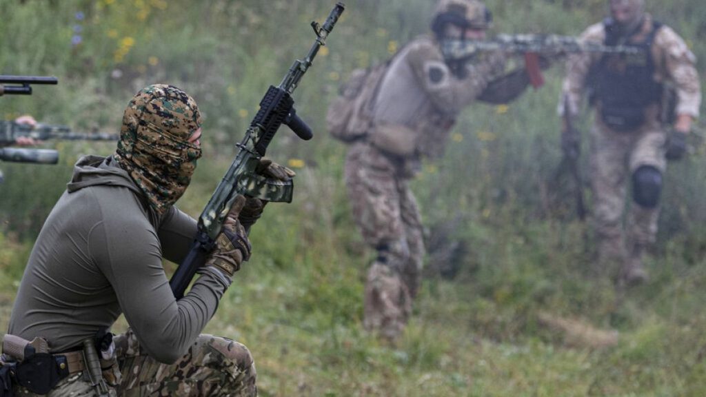 Volunteer soldiers attend a training outside Kyiv, Ukraine, Saturday, Aug. 27, 2022.