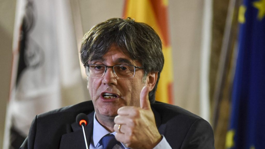 Catalan leader Carles Puigdemont speaks at a press conference in Alghero, Sardinia, on Oct. 4, 2021