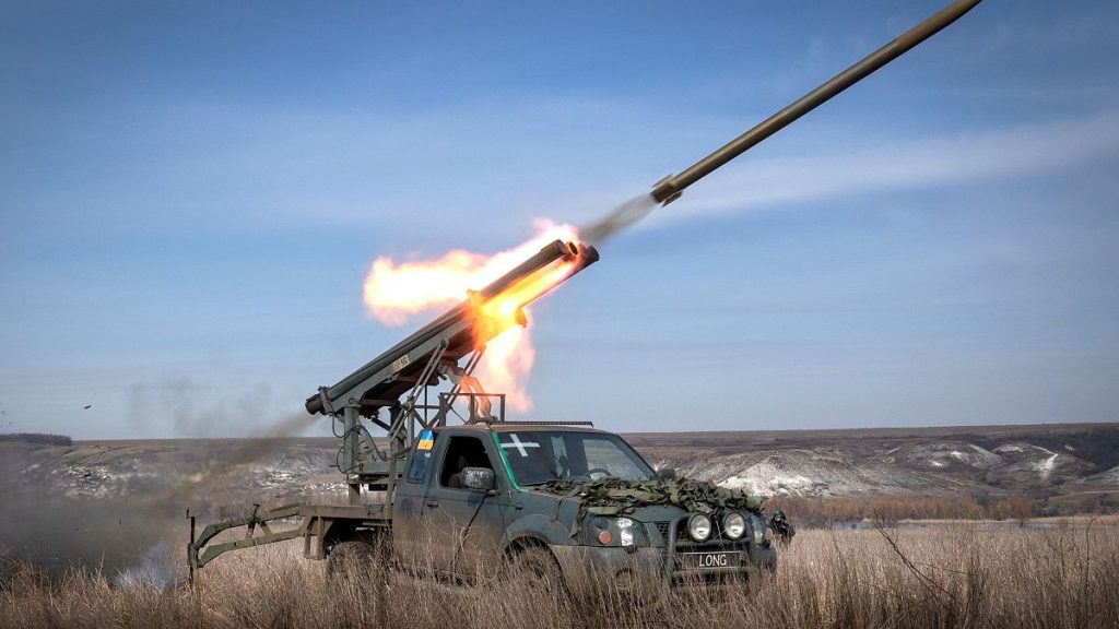 A multiple launch rocket system based on a pickup truck fires towards Russian positions at the front line, near Bakhmut, Donetsk region, Ukraine, Tuesday, March 5, 2024.