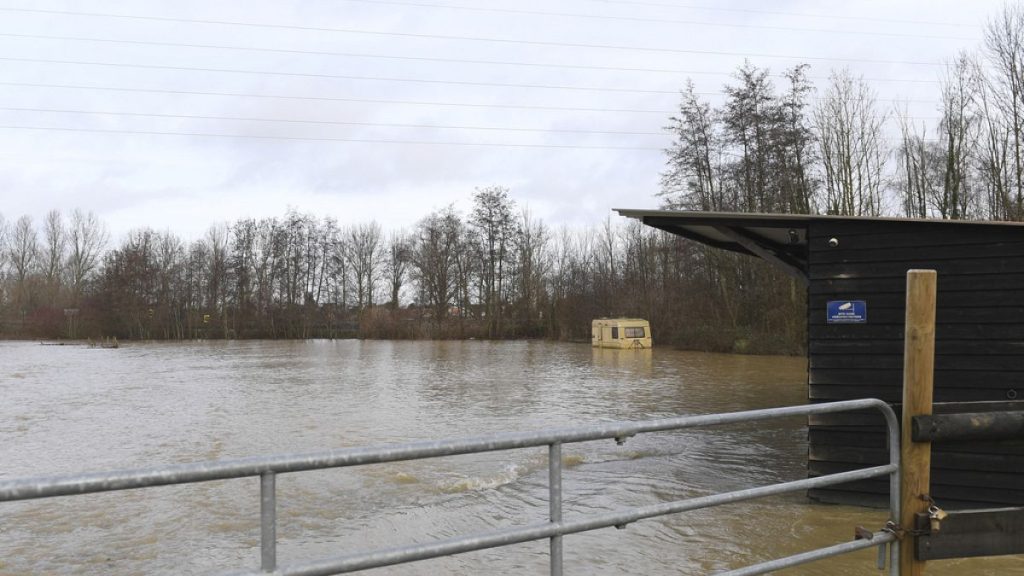 A trailer is under water as the river Aa floods the area in Blendecques, northern France, Thursday, Jan.4, 2024.