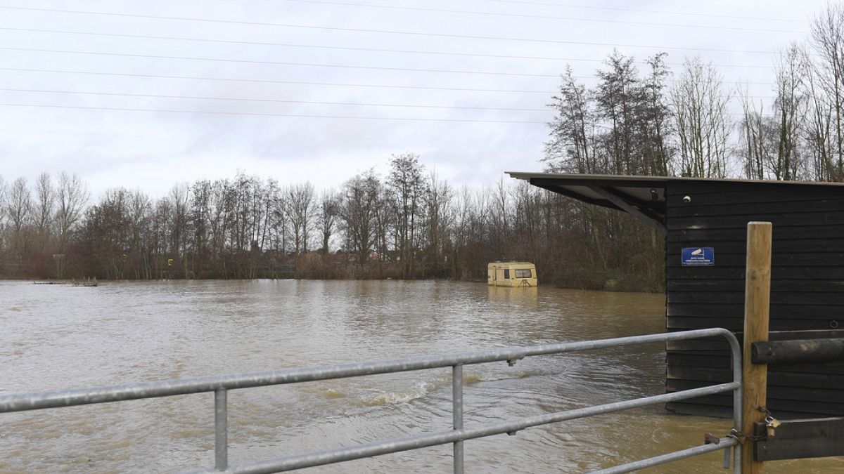 A trailer is under water as the river Aa floods the area in Blendecques, northern France, Thursday, Jan.4, 2024.