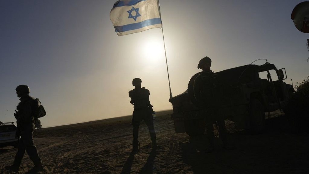 Israeli soldiers are seen near the Gaza Strip border in southern Israel, Monday, March 4, 2024.