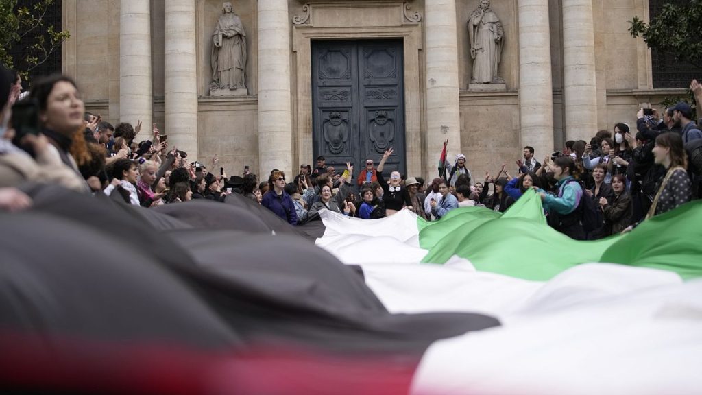 Students demonstrate outside Sorbonne University with a huge Palestinian flag, April 29, 2024