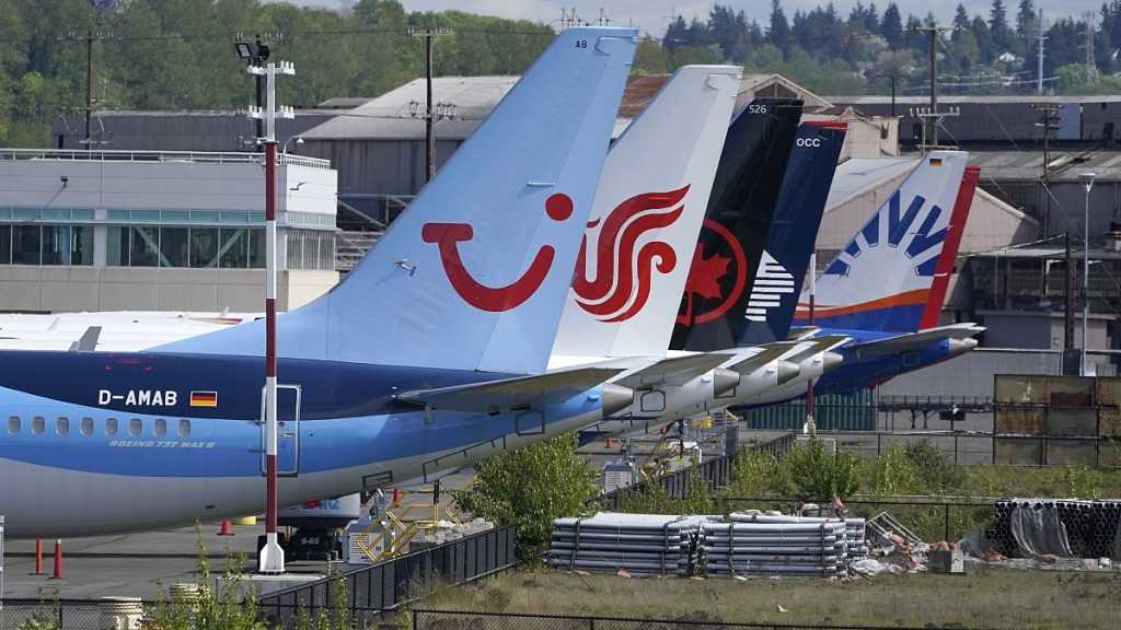 Boeing 737 Max airplanes, including one belonging to TUI Group, parked at a storage lot near Boeing Field in Seattle. April 26, 2021.