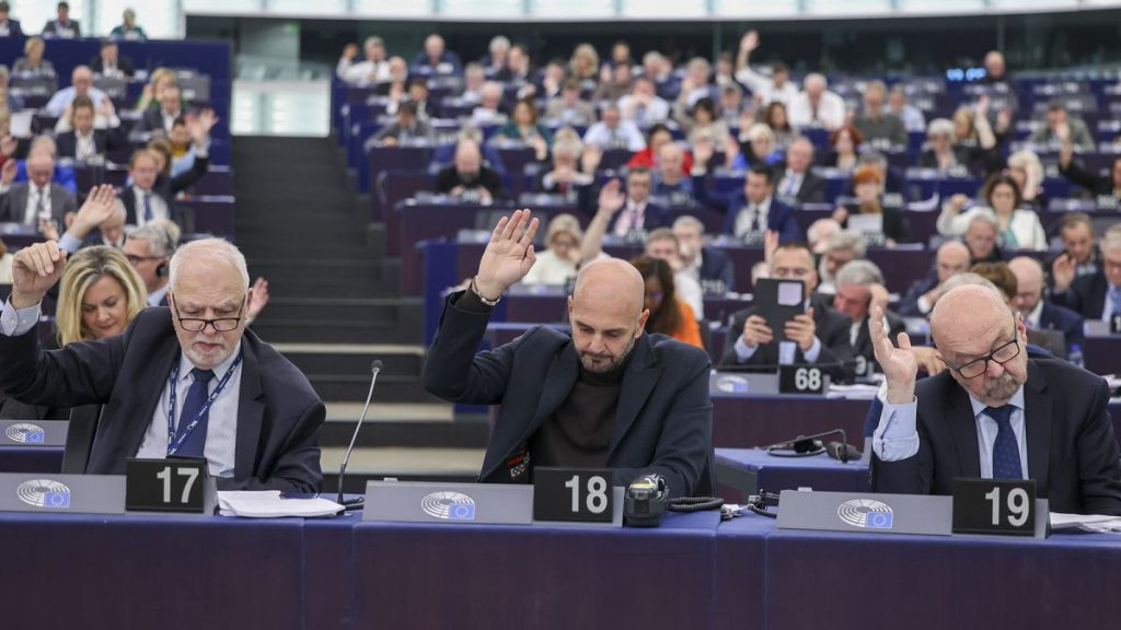 Members of the European Parliament for the ECR group vote during a plenary session in Strasbourg,