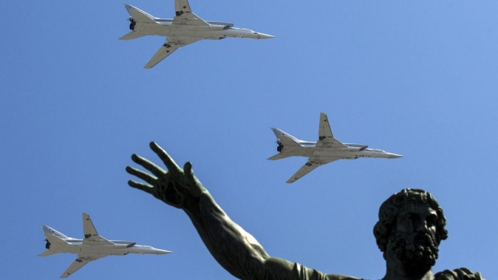 FILE - Russian Tu-22M-3 long-range bombers fly during the Victory Day military parade marking 71 years after the victory in WWII in Red Square in Moscow, Russia, 2016.