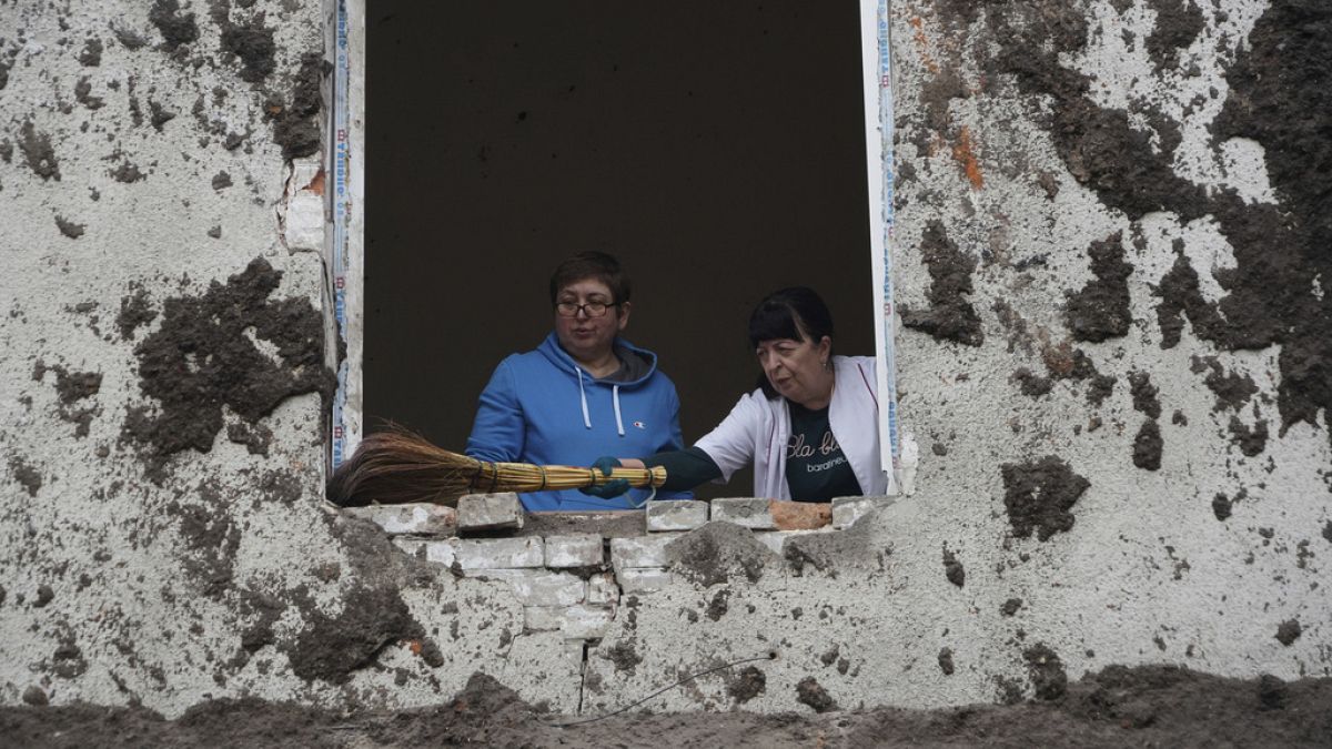 Nurses clean up in the room after a Russian attack on mental hospital №3 in Kharkiv, Ukraine, Saturday, April 27, 2024.