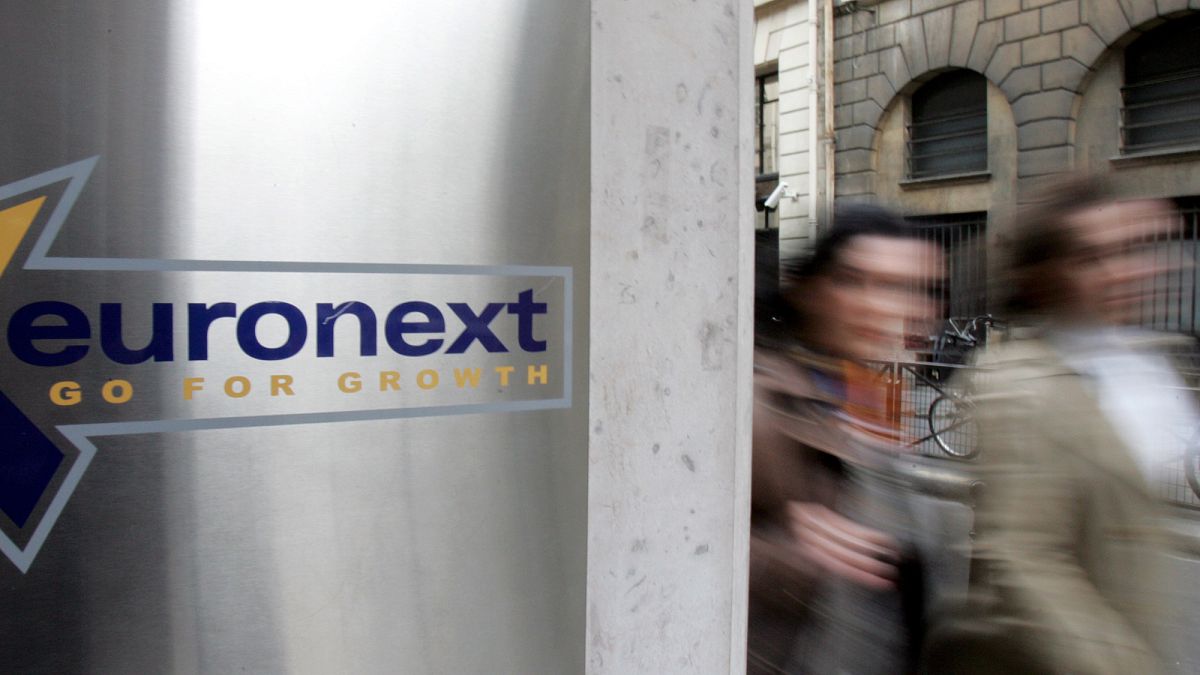 People walk past the Euronext headquarters in Paris (file photo)