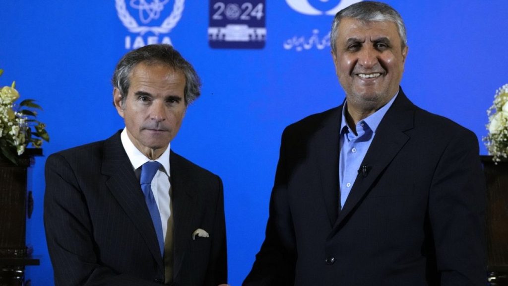 International Atomic Energy Organization, IAEA, Director General Rafael Grossi, left, and head of Iran