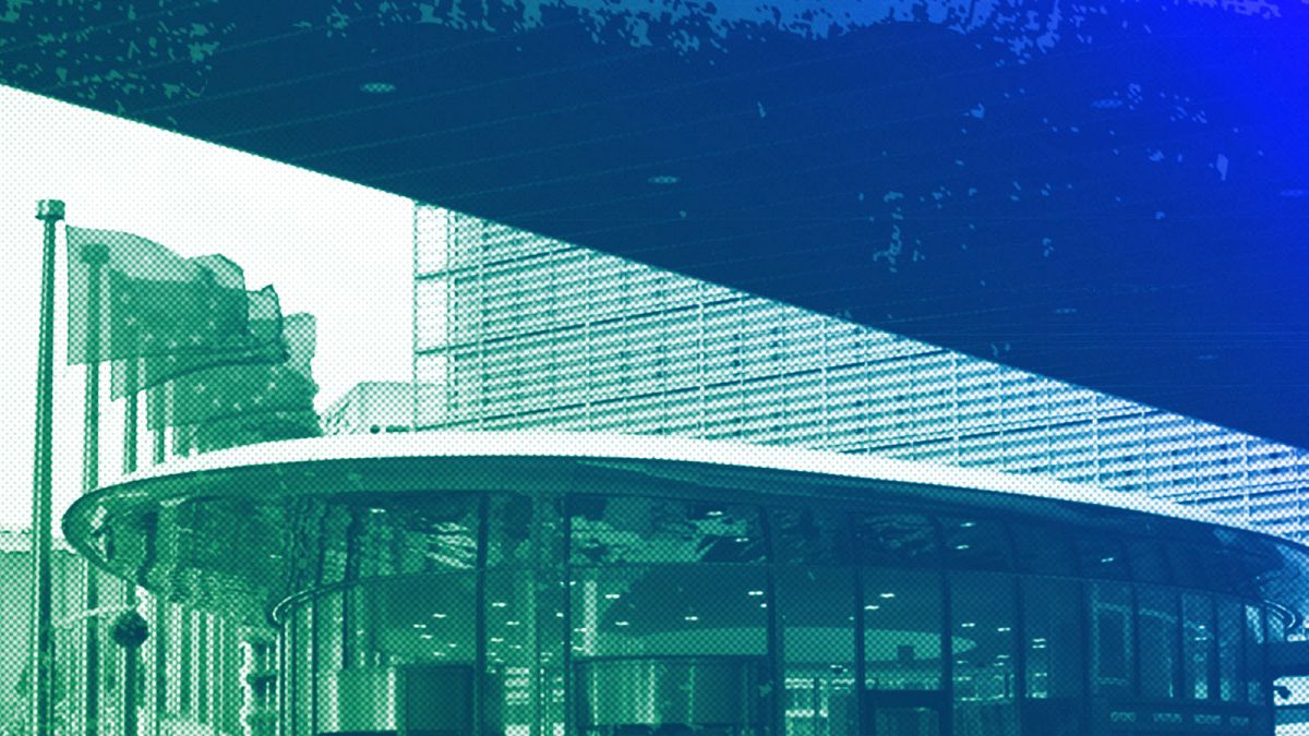 European Union flags flap in the wind outside European Commission headquarters in Brussels, April 2024