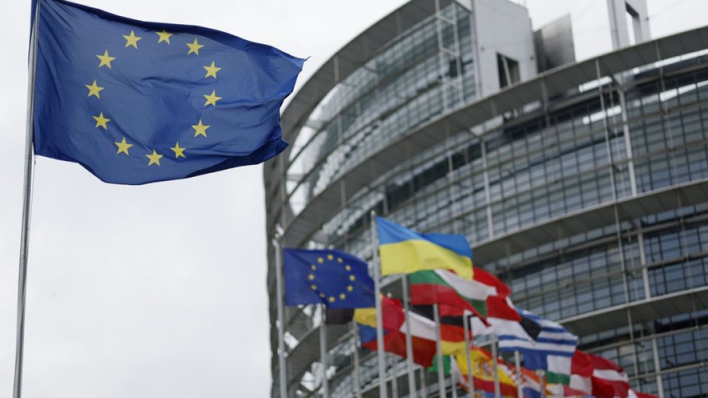 The European flag, left, flies Tuesday, April 18, 2023 at the European Parliament in Strasbourg, eastern France.