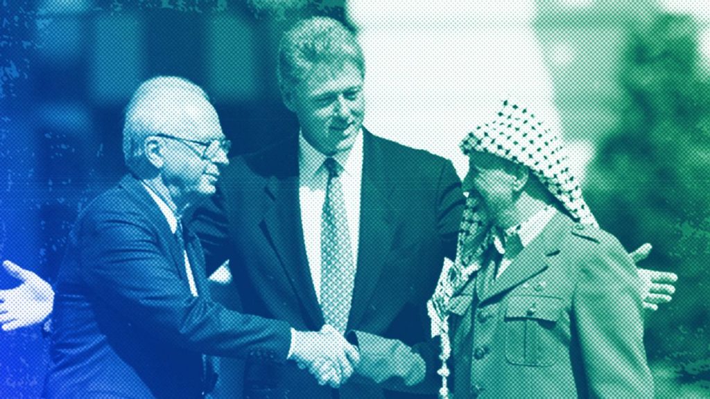 Israeli Prime Minister Yitzhak Rabin and Palestinian leader Yasser Arafat shake hands marking the signing of peace accord in Washington, September 1993