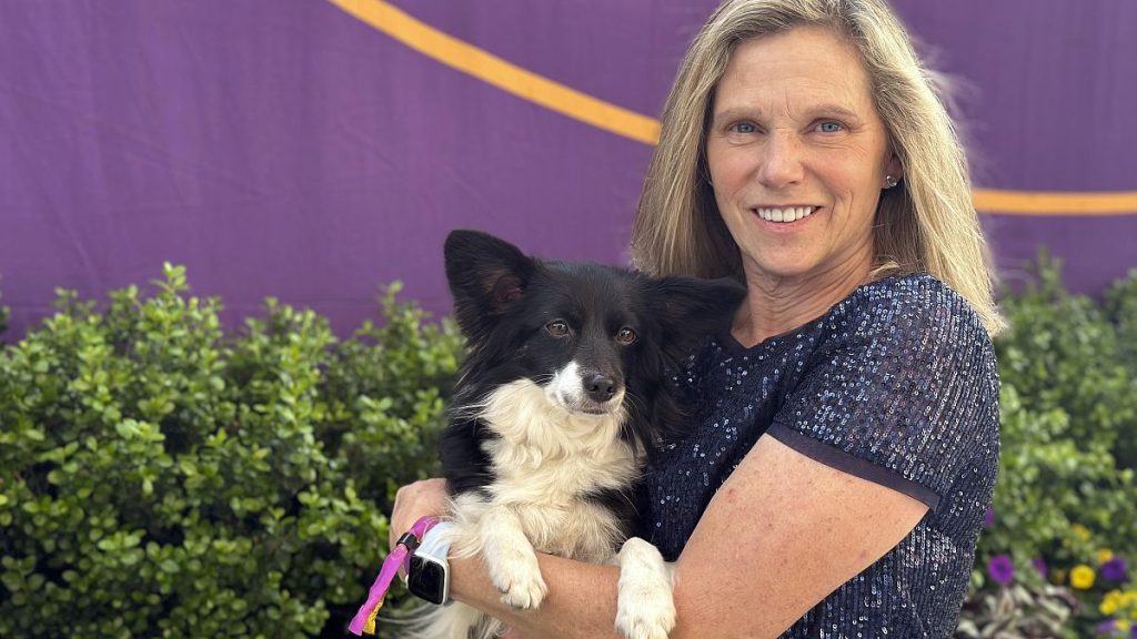 Cynthia Hornor poses with Nimble, the first mixed-breed dog ever to win the Westminster Kennel Club dog show